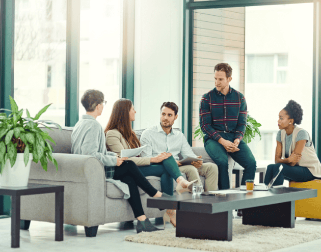 five people sat in a meeting