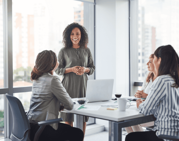 four people in a meeting