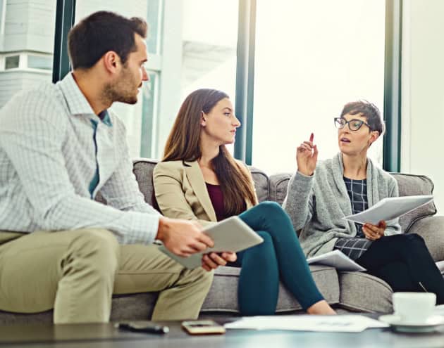 Three people in a meeting